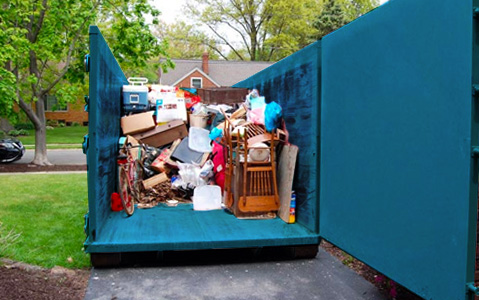 Junk Removal Dumpster Full of Household Debris